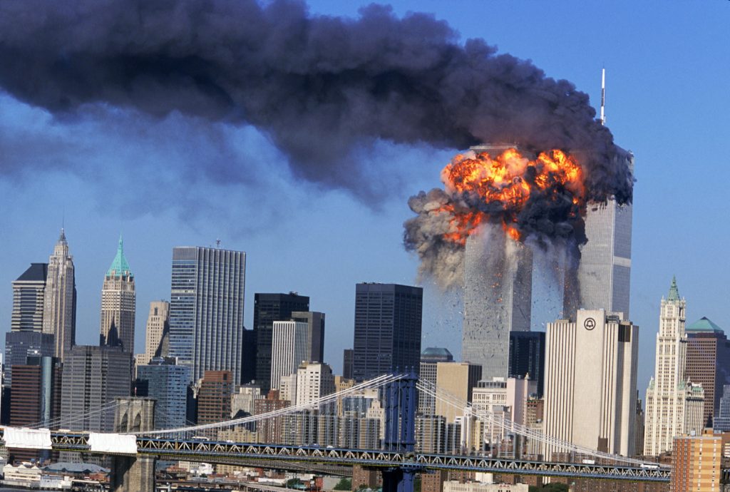 SEVENTH IN A PACKAGE OF NINE PHOTOS. An explosion rips through the South Tower of the World Trade Towers after the hijacked United Airlines Flight 175, which departed from Boston en route for Los Angeles, crashed into it Sept, 11, 2001. The North Tower is shown burning after American Airlines Flight 11 crashed into the tower at 8:45 a.m. (AP Photo/Aurora, Robert Clark)
