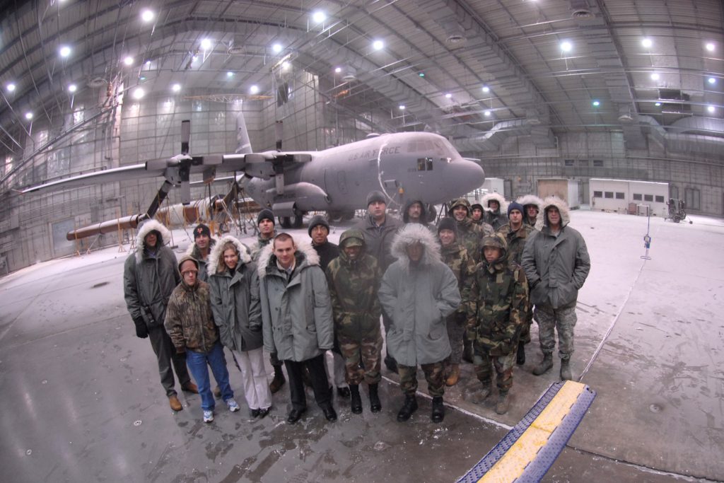 EGLIN AIR FORCE BASE, Fla. -- A group of Airmen from the Eglin Junior Force Council visits the McKinley Climatic Laboratory during a tour of the lab during extreme cold testing on a C-130 Hercules. The group of EJFC members took advantage of an opportunity to explore the lab while the temperatures were at -40 degrees Fahrenheit, as part of a program "Eglin Exploration." The program is a hands-on exploration of other missions on base designed for the junior force members. (U.S. Air Force photo by Staff Sgt. Mike Meares)